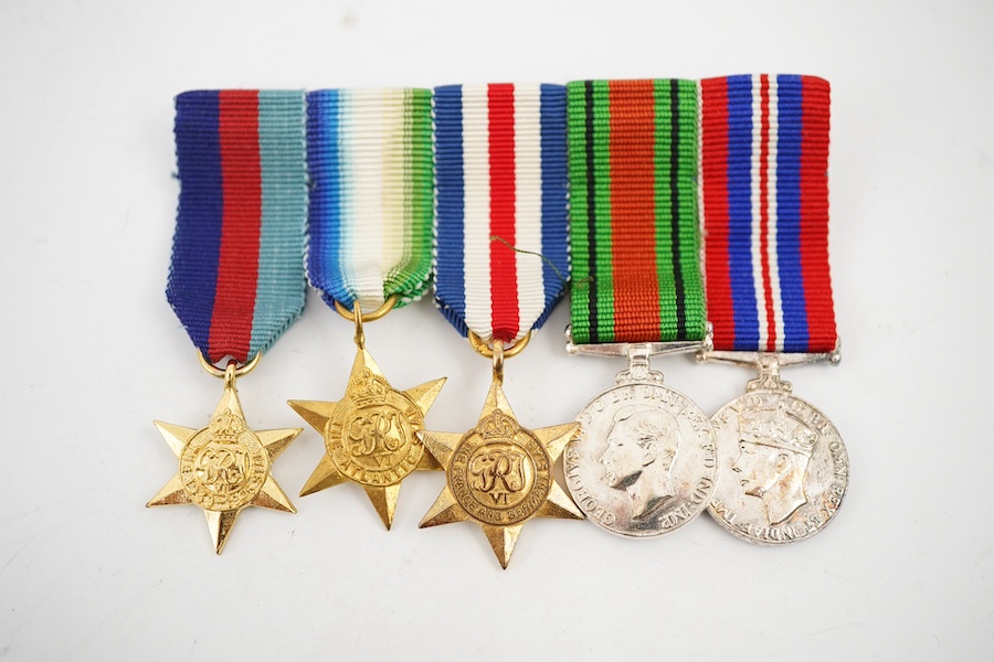 A First World War George V Bravery in the field medal awarded to CPL. R.E. Cox 11th Royal Sussex, a Second World War trio and miniatures, a Masonic medal, etc. (11). Condition - fair to good.